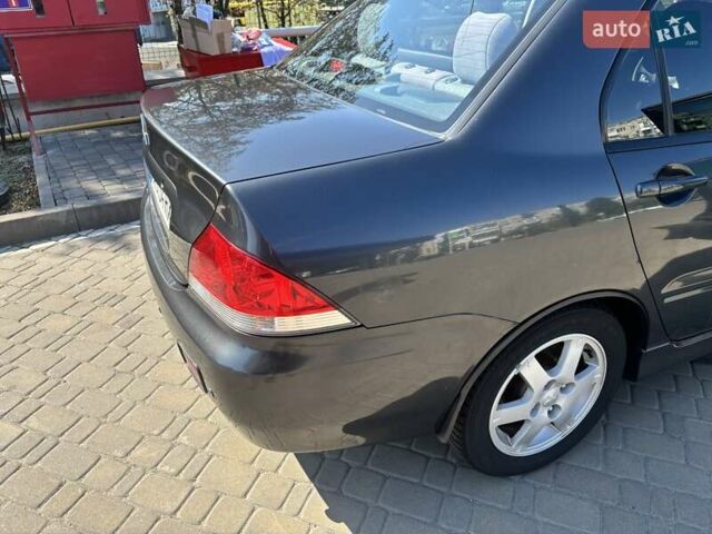 Сірий Міцубісі Lancer, об'ємом двигуна 1.58 л та пробігом 167 тис. км за 5100 $, фото 10 на Automoto.ua