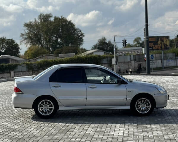 Сірий Міцубісі Lancer, об'ємом двигуна 1.6 л та пробігом 260 тис. км за 3899 $, фото 5 на Automoto.ua