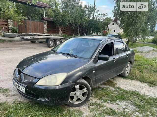 Сірий Міцубісі Lancer, об'ємом двигуна 1.58 л та пробігом 230 тис. км за 3500 $, фото 3 на Automoto.ua