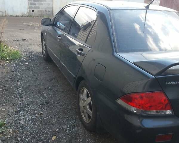 Сірий Міцубісі Lancer, об'ємом двигуна 1.58 л та пробігом 531 тис. км за 2828 $, фото 9 на Automoto.ua