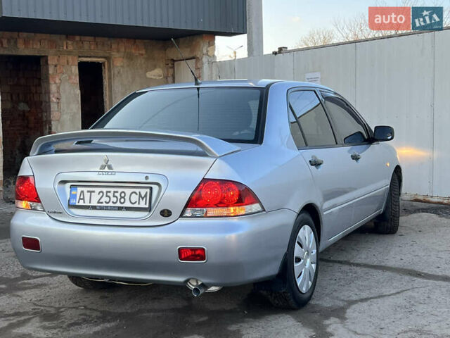 Серый Мицубиси Лансер, объемом двигателя 1.6 л и пробегом 320 тыс. км за 3650 $, фото 22 на Automoto.ua