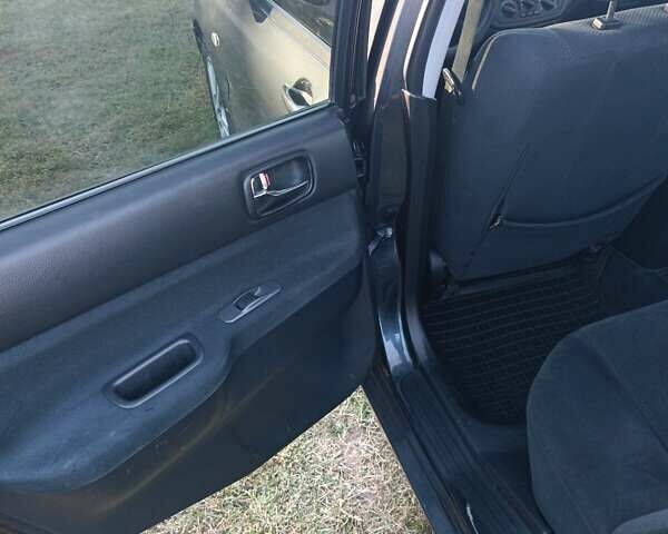 Мицубиси Лансер 2004 в Нежине на Automoto.ua Серый Мицубиси Лансер, объемом двигателя 2 л и пробегом 280 тыс. км за 6000 $, фото 11 на Automoto.ua