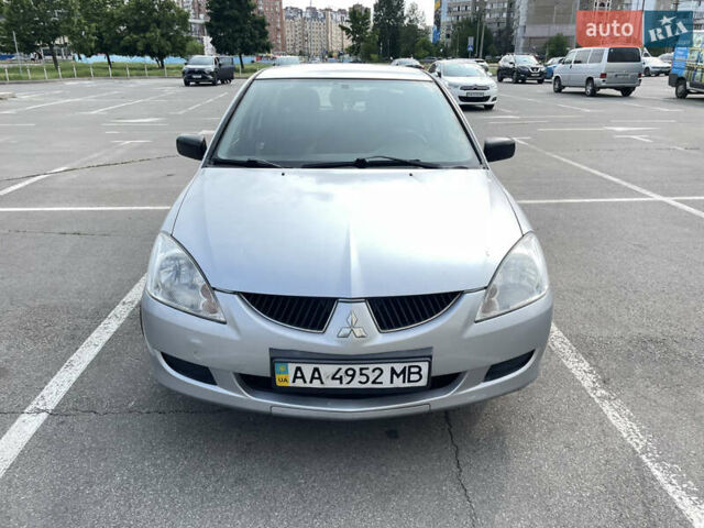 Серый Мицубиси Лансер, объемом двигателя 1.6 л и пробегом 240 тыс. км за 3200 $, фото 1 на Automoto.ua
