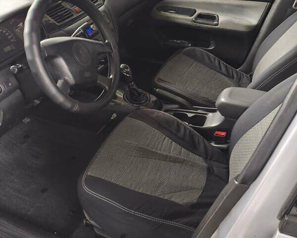 Сірий Міцубісі Lancer, об'ємом двигуна 1.58 л та пробігом 320 тис. км за 3700 $, фото 9 на Automoto.ua