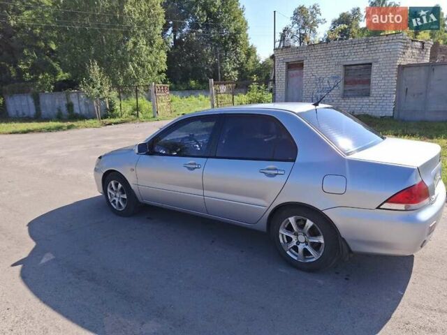 Серый Мицубиси Лансер, объемом двигателя 1.58 л и пробегом 270 тыс. км за 3800 $, фото 4 на Automoto.ua