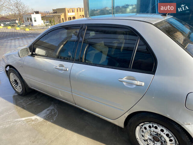 Сірий Міцубісі Lancer, об'ємом двигуна 1.3 л та пробігом 376 тис. км за 3700 $, фото 6 на Automoto.ua