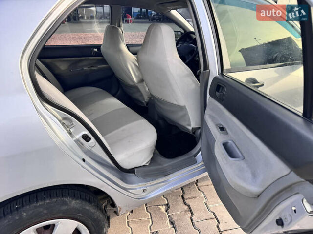 Сірий Міцубісі Lancer, об'ємом двигуна 1.3 л та пробігом 450 тис. км за 2650 $, фото 16 на Automoto.ua