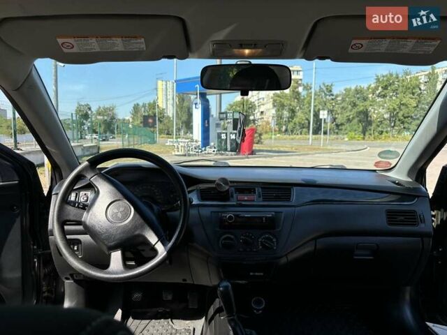 Сірий Міцубісі Lancer, об'ємом двигуна 1.58 л та пробігом 167 тис. км за 5100 $, фото 36 на Automoto.ua