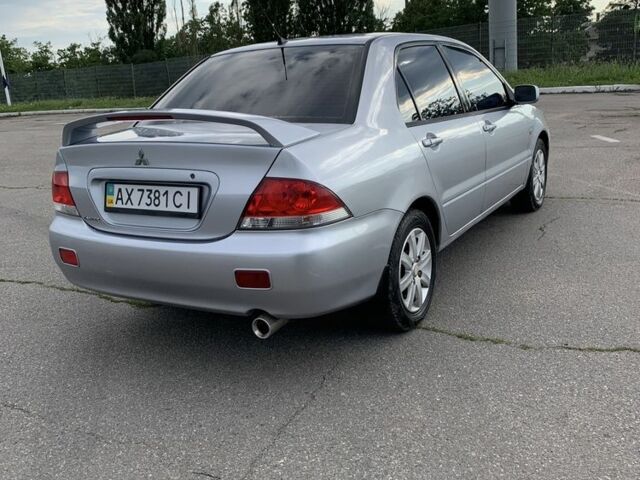 Сірий Міцубісі Lancer, об'ємом двигуна 1.6 л та пробігом 285 тис. км за 4450 $, фото 4 на Automoto.ua