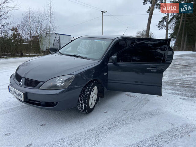 Серый Мицубиси Лансер, объемом двигателя 1.58 л и пробегом 265 тыс. км за 3499 $, фото 20 на Automoto.ua