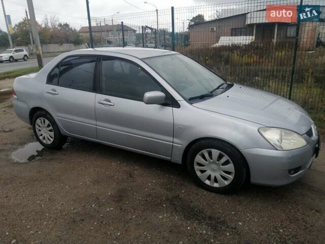 Міцубісі Lancer 2004 у Харкові на Automoto.ua Сірий Міцубісі Lancer, об'ємом двигуна 1.58 л та пробігом 248 тис. км за 3550 $, фото 11 на Automoto.ua