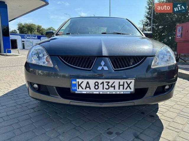 Сірий Міцубісі Lancer, об'ємом двигуна 1.58 л та пробігом 167 тис. км за 5100 $, фото 6 на Automoto.ua