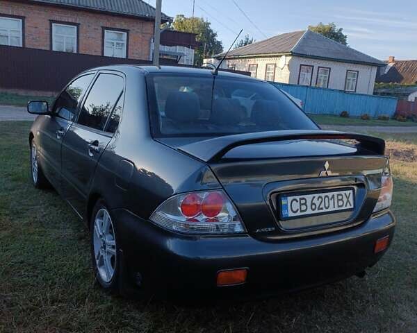 Мицубиси Лансер 2004 в Нежине на Automoto.ua Серый Мицубиси Лансер, объемом двигателя 2 л и пробегом 280 тыс. км за 6000 $, фото 5 на Automoto.ua