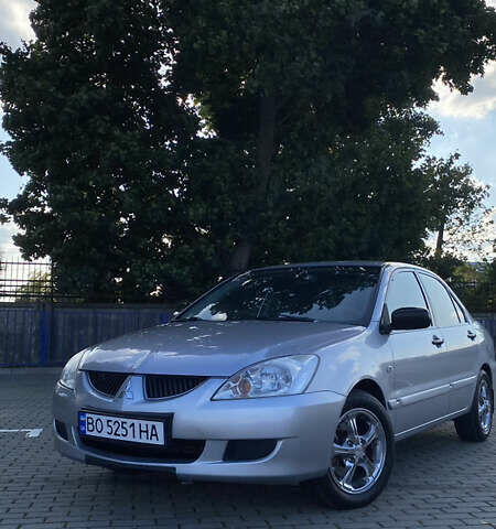 Сірий Міцубісі Lancer, об'ємом двигуна 1.58 л та пробігом 270 тис. км за 1999 $, фото 2 на Automoto.ua