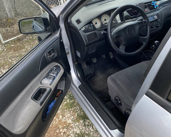 Сірий Міцубісі Lancer, об'ємом двигуна 1.58 л та пробігом 268 тис. км за 3799 $, фото 10 на Automoto.ua