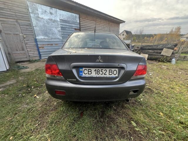 Серый Мицубиси Лансер, объемом двигателя 1.6 л и пробегом 200 тыс. км за 2400 $, фото 4 на Automoto.ua