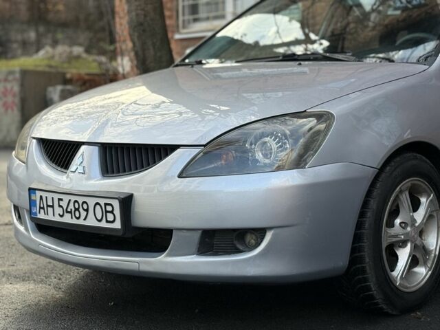 Серый Мицубиси Лансер, объемом двигателя 2 л и пробегом 180 тыс. км за 3700 $, фото 1 на Automoto.ua