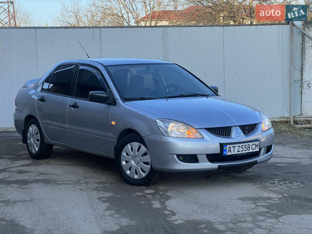 Серый Мицубиси Лансер, объемом двигателя 1.6 л и пробегом 320 тыс. км за 3650 $, фото 2 на Automoto.ua