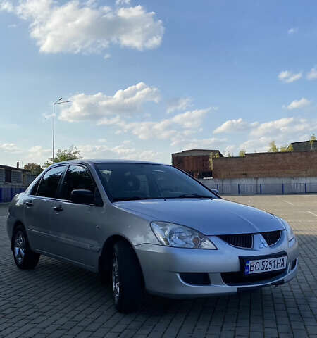 Сірий Міцубісі Lancer, об'ємом двигуна 1.58 л та пробігом 270 тис. км за 1999 $, фото 7 на Automoto.ua