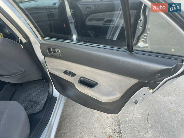 Сірий Міцубісі Lancer, об'ємом двигуна 1.58 л та пробігом 271 тис. км за 3000 $, фото 26 на Automoto.ua