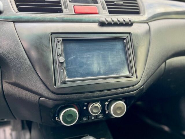 Серый Мицубиси Лансер, объемом двигателя 1.6 л и пробегом 490 тыс. км за 1799 $, фото 18 на Automoto.ua