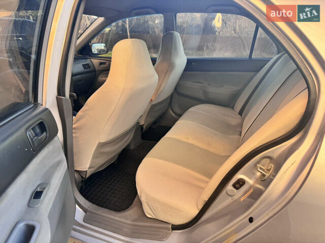 Сірий Міцубісі Lancer, об'ємом двигуна 1.3 л та пробігом 450 тис. км за 2750 $, фото 12 на Automoto.ua