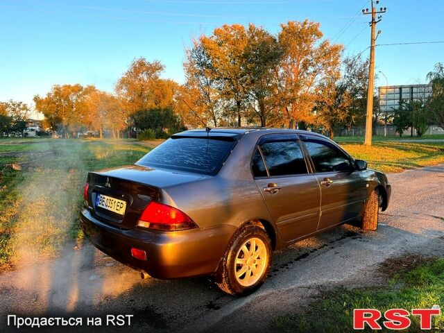 Серый Мицубиси Лансер, объемом двигателя 1.6 л и пробегом 275 тыс. км за 3000 $, фото 4 на Automoto.ua