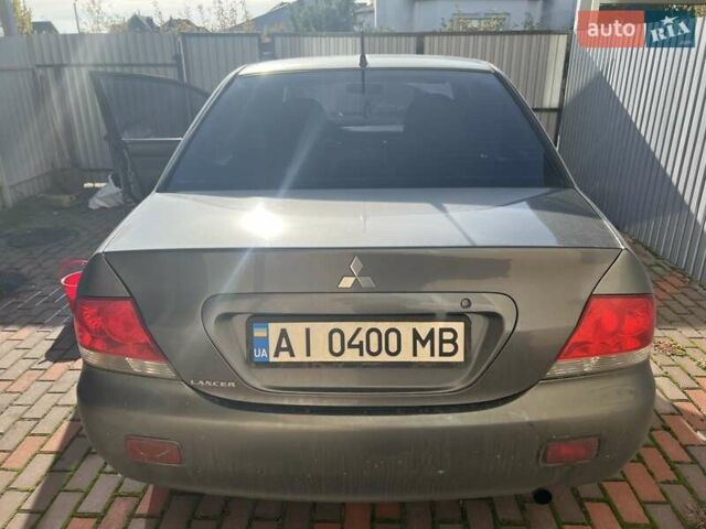 Сірий Міцубісі Lancer, об'ємом двигуна 1.58 л та пробігом 262 тис. км за 3900 $, фото 1 на Automoto.ua