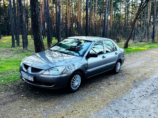 Сірий Міцубісі Lancer, об'ємом двигуна 1.3 л та пробігом 306 тис. км за 2700 $, фото 1 на Automoto.ua