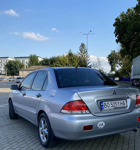 Сірий Міцубісі Lancer, об'ємом двигуна 1.58 л та пробігом 270 тис. км за 1999 $, фото 4 на Automoto.ua