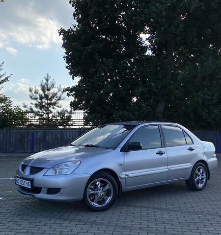 Сірий Міцубісі Lancer, об'ємом двигуна 1.58 л та пробігом 270 тис. км за 1999 $, фото 3 на Automoto.ua