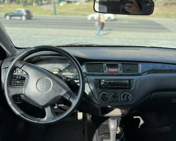 Сірий Міцубісі Lancer, об'ємом двигуна 1.6 л та пробігом 260 тис. км за 3899 $, фото 10 на Automoto.ua