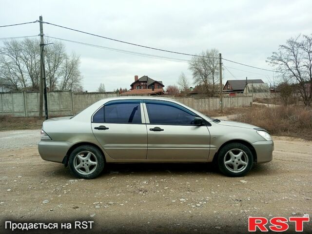 Сірий Міцубісі Lancer, об'ємом двигуна 1.3 л та пробігом 223 тис. км за 4300 $, фото 5 на Automoto.ua