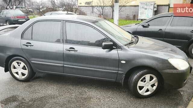 Сірий Міцубісі Lancer, об'ємом двигуна 1.58 л та пробігом 110 тис. км за 2999 $, фото 5 на Automoto.ua