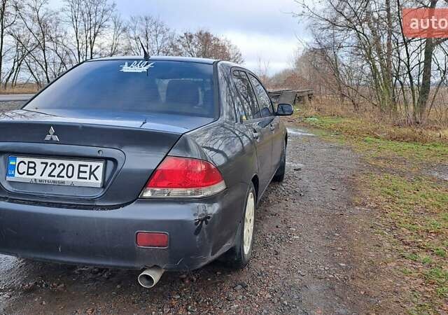 Мицубиси Лансер 2004 в Чернигове на Automoto.ua Серый Мицубиси Лансер, объемом двигателя 1.58 л и пробегом 320 тыс. км за 3900 $, фото 5 на Automoto.ua