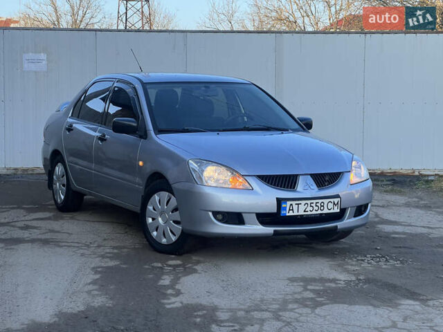Серый Мицубиси Лансер, объемом двигателя 1.6 л и пробегом 320 тыс. км за 3650 $, фото 1 на Automoto.ua