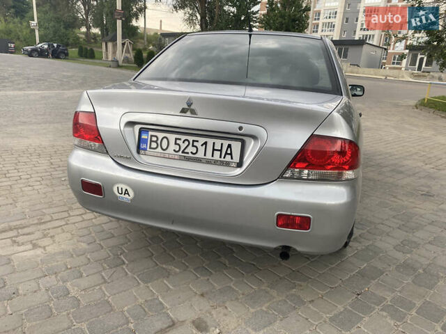 Сірий Міцубісі Lancer, об'ємом двигуна 1.58 л та пробігом 268 тис. км за 3799 $, фото 5 на Automoto.ua