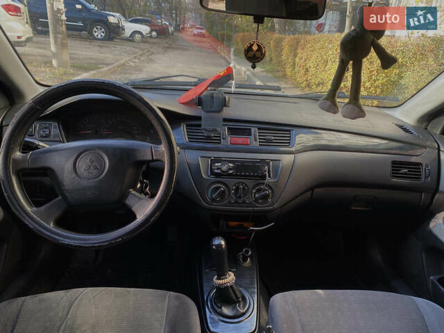 Сірий Міцубісі Lancer, об'ємом двигуна 1.3 л та пробігом 376 тис. км за 3700 $, фото 7 на Automoto.ua