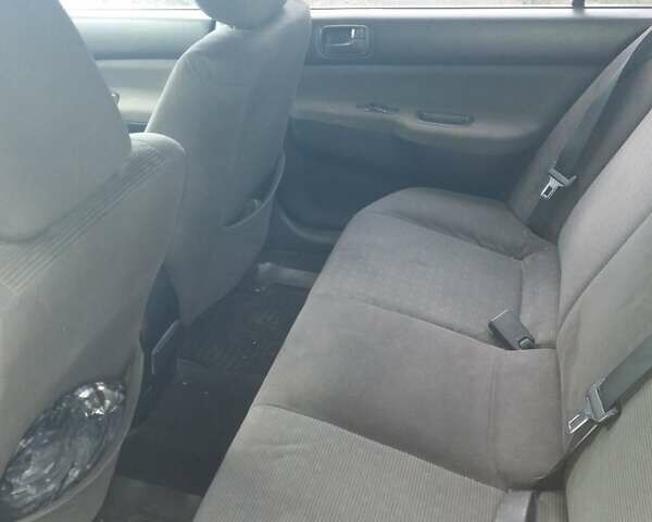 Сірий Міцубісі Lancer, об'ємом двигуна 1.58 л та пробігом 531 тис. км за 2828 $, фото 10 на Automoto.ua