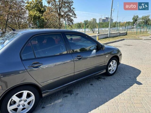 Сірий Міцубісі Lancer, об'ємом двигуна 1.58 л та пробігом 167 тис. км за 5100 $, фото 3 на Automoto.ua