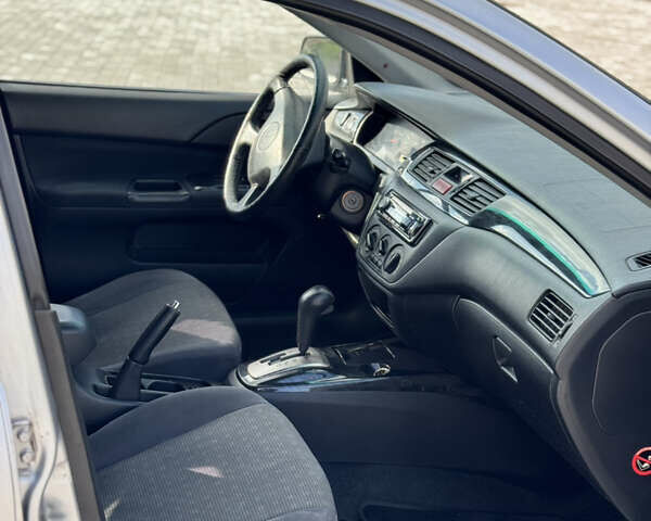 Сірий Міцубісі Lancer, об'ємом двигуна 1.6 л та пробігом 260 тис. км за 3899 $, фото 8 на Automoto.ua