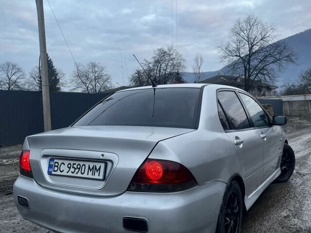 Серый Мицубиси Лансер, объемом двигателя 1.6 л и пробегом 315 тыс. км за 2950 $, фото 2 на Automoto.ua