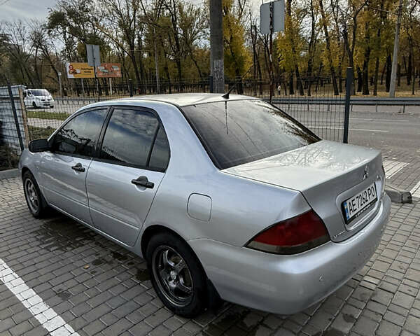 Серый Мицубиси Лансер, объемом двигателя 1.29 л и пробегом 263 тыс. км за 3400 $, фото 4 на Automoto.ua