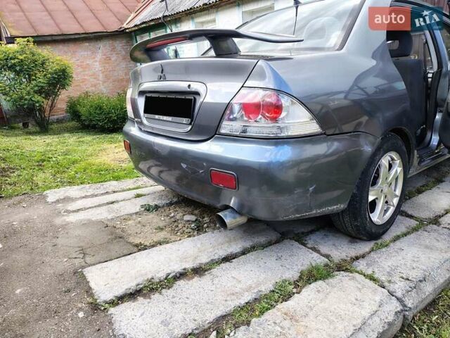 Сірий Міцубісі Lancer, об'ємом двигуна 1.58 л та пробігом 300 тис. км за 4200 $, фото 6 на Automoto.ua