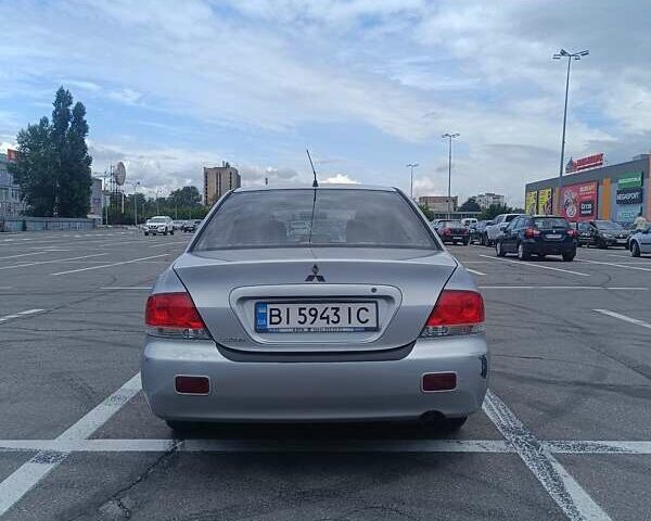 Сірий Міцубісі Lancer, об'ємом двигуна 1.6 л та пробігом 242 тис. км за 4300 $, фото 3 на Automoto.ua