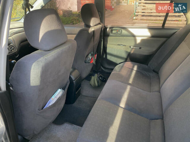 Сірий Міцубісі Lancer, об'ємом двигуна 1.3 л та пробігом 376 тис. км за 3700 $, фото 10 на Automoto.ua
