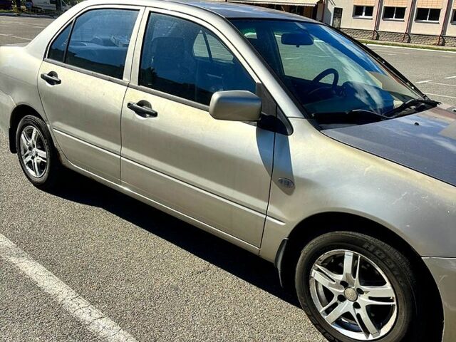 Серый Мицубиси Лансер, объемом двигателя 1.3 л и пробегом 245 тыс. км за 3000 $, фото 5 на Automoto.ua