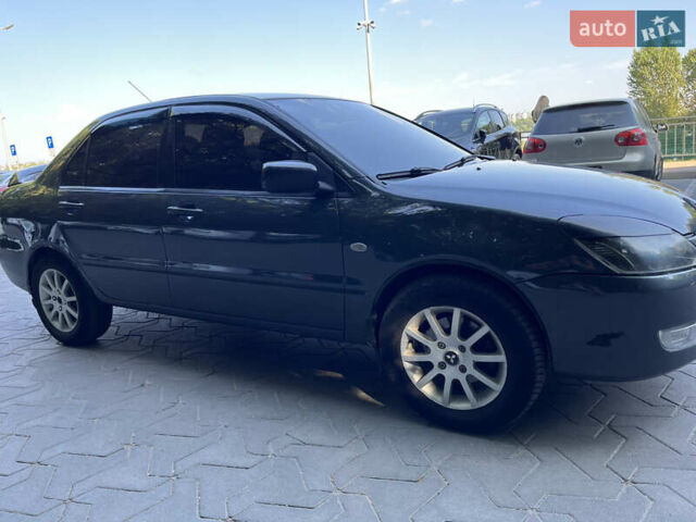 Сірий Міцубісі Lancer, об'ємом двигуна 1.58 л та пробігом 300 тис. км за 3800 $, фото 6 на Automoto.ua