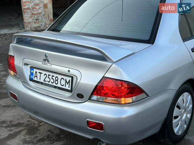 Серый Мицубиси Лансер, объемом двигателя 1.6 л и пробегом 320 тыс. км за 3650 $, фото 23 на Automoto.ua
