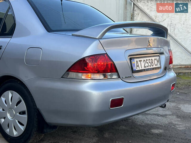 Серый Мицубиси Лансер, объемом двигателя 1.6 л и пробегом 320 тыс. км за 3650 $, фото 21 на Automoto.ua